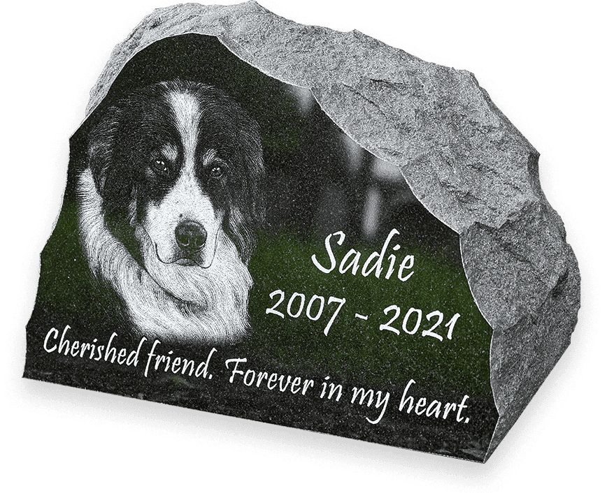 Rustic pet memorial garden stone with a natural rock edge and a polished black face for the engraving.