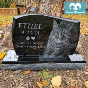Black granite upright pet memorial engraved with a portrait of Ethel the cat and the inscription “Ethel – Love You Forever Until We Meet Again.”