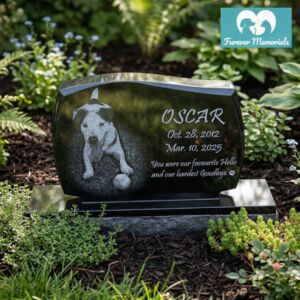 Custom engraved black granite upright pet memorial for dog Oscar with detailed portrait engraving and inscription, displayed in a landscaped garden